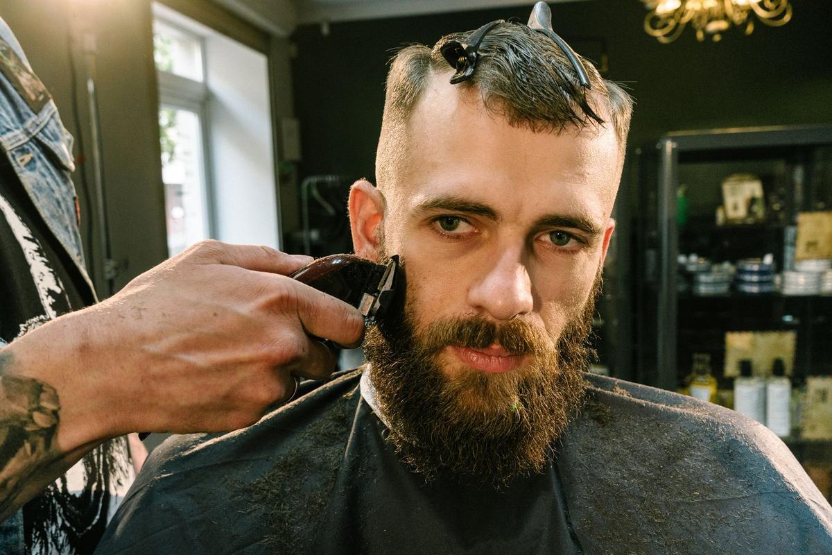 Clippers shaping a beard with a crisp edge